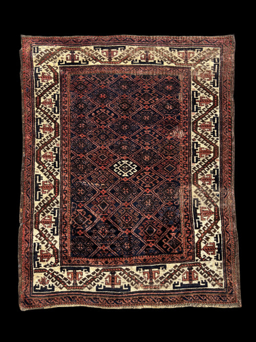 Highly decorative antique oriental rug from nomads of Baluchistan.