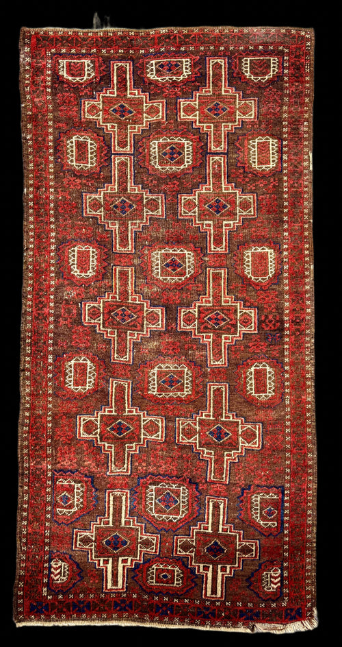 Decorative rug with intricate patterns on a textured surface